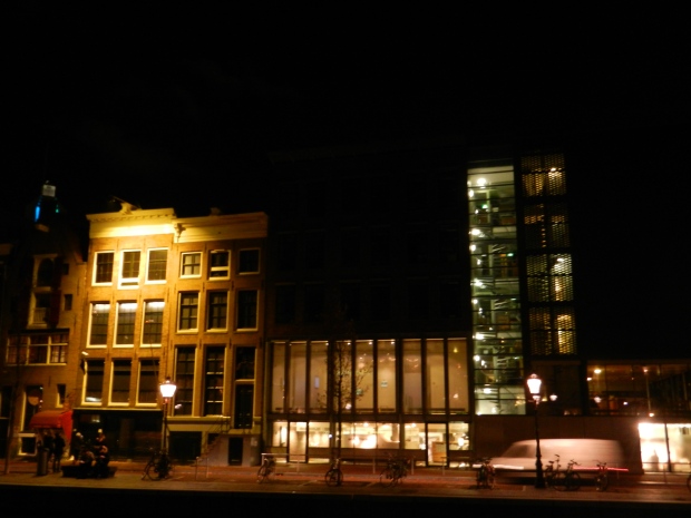 A view of Anne Frank's house at night. Notice the blackened windows. This was required to help avoid/prevent air strikes at night. 