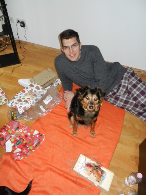 Jeff modeling his new sweater and PJ pants on our little Christmas "picnic" blanket.
